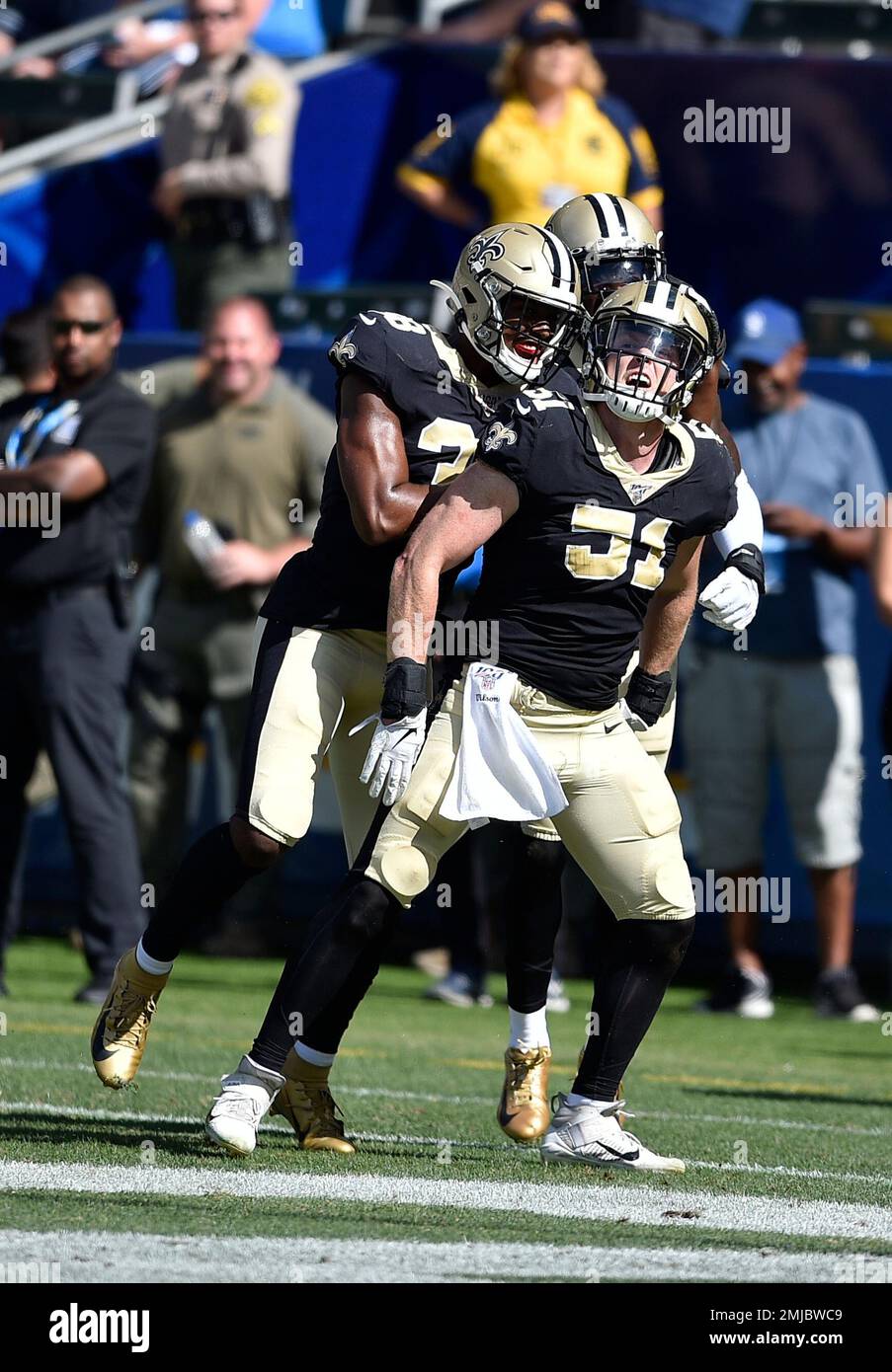 Jacksonville Jaguars running back Corey Grant, left, runs pass New Orleans  Saints linebacker Colton Jumper (58) during the first half of an NFL  preseason football game, Thursday, Aug. 9, 2018, in Jacksonville