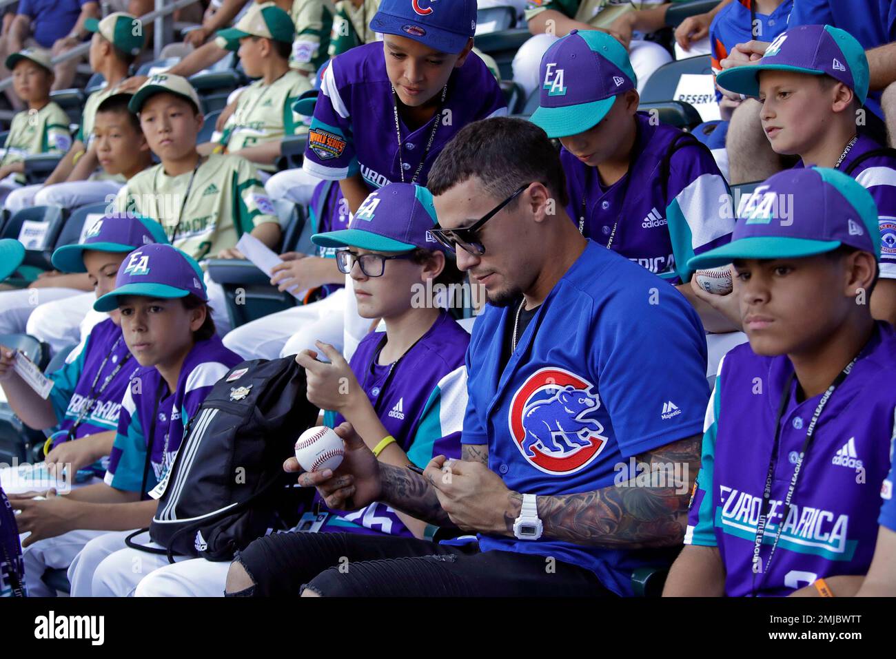 Chicago Cubs' Javier Baez signs autographs in the stands of Volunteer  Stadium while sitting with members of the team from Italy before at the Little  League World Series tournament in South Williamsport,