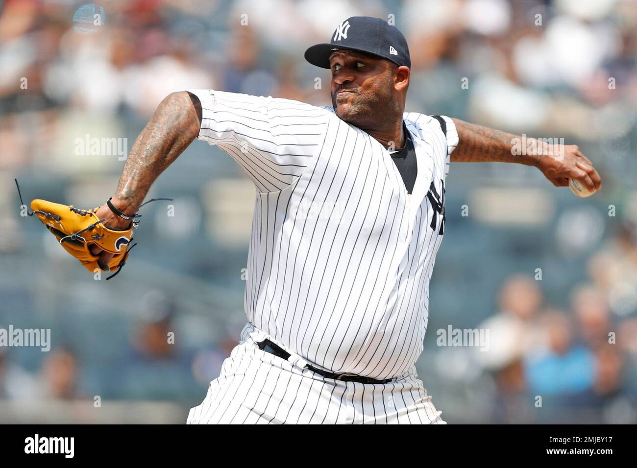 New York Yankees' Starting Pitcher CC Sabathia (52) Winds Up During The ...