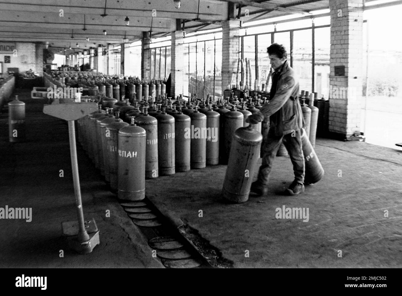 Propane bottles at a gas bottle filling station for residents in Riga