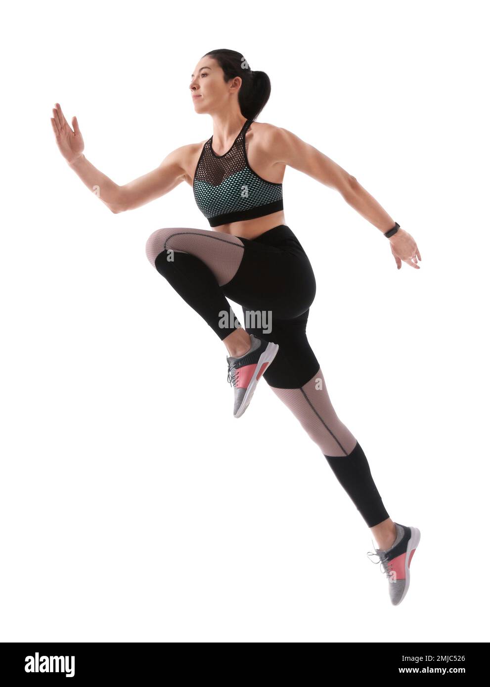 Athletic young woman running on white background, side view Stock Photo ...