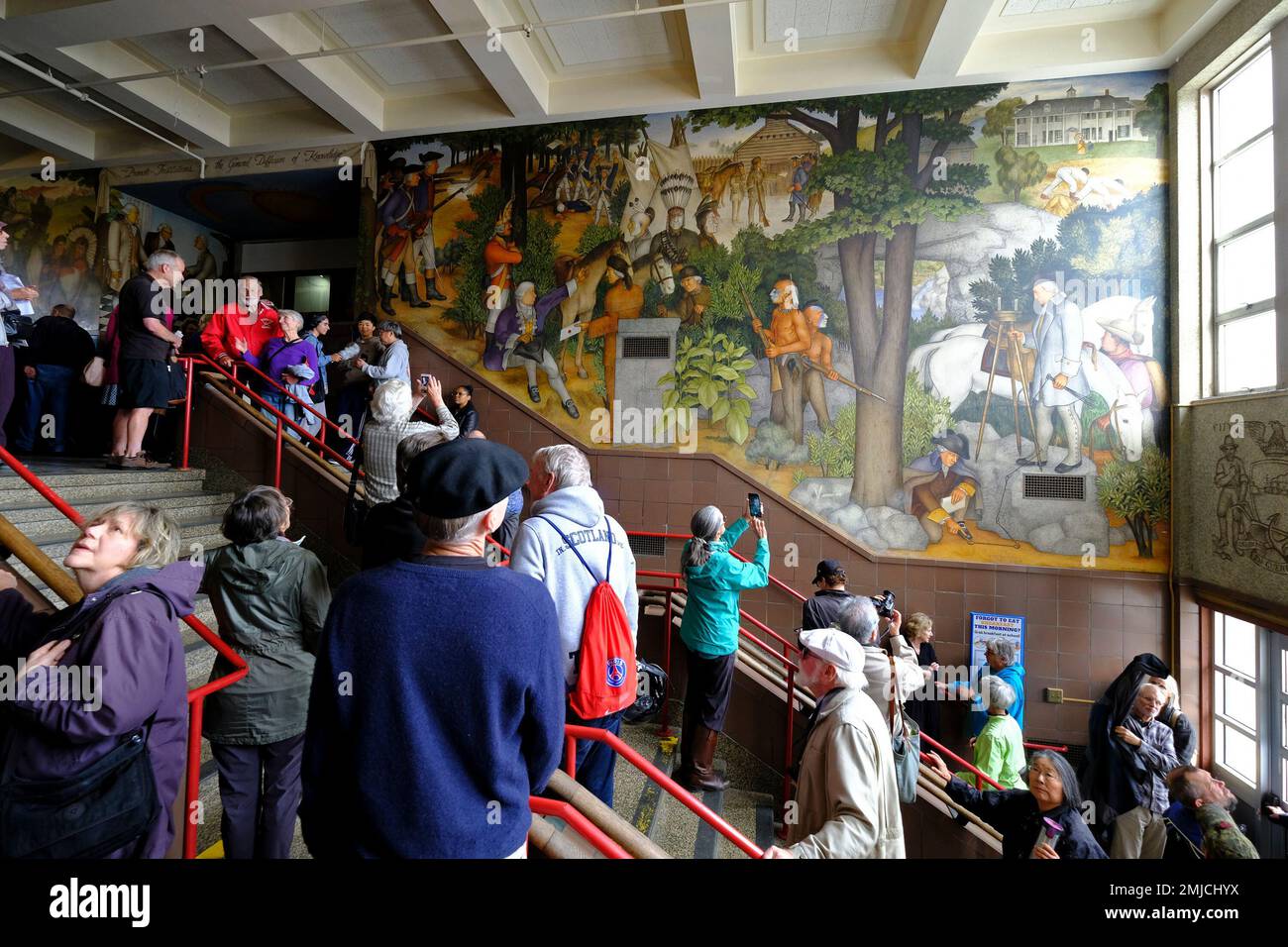 People fill the main entryway of Washington High School to view