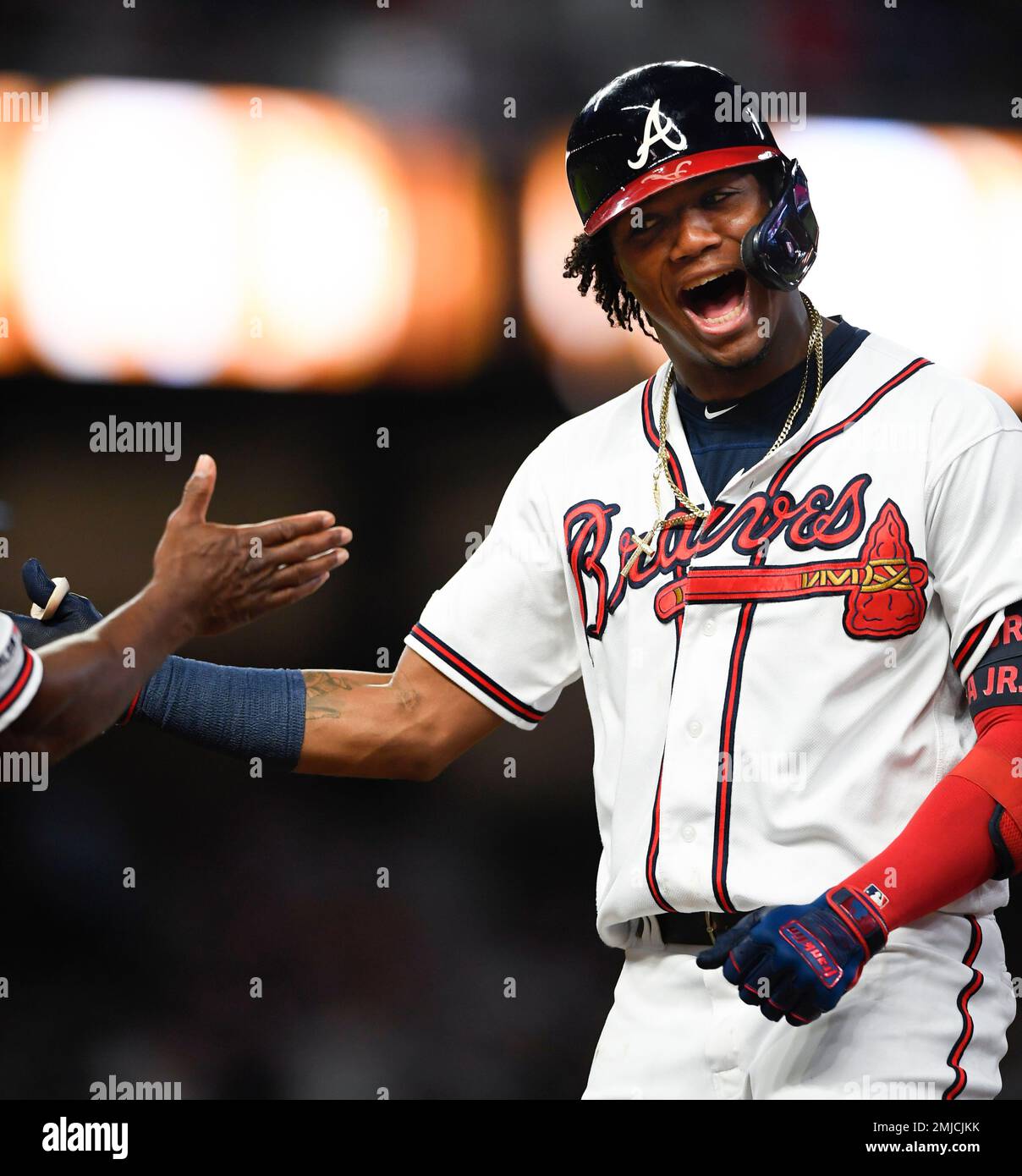 Atlanta Braves' Ronald Acuna Jr. celebrates at first base after hitting ...
