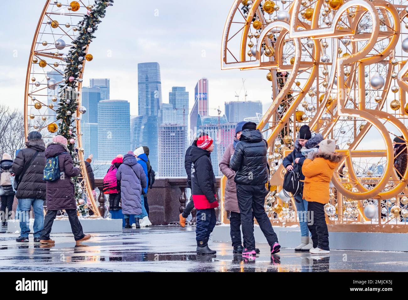 Russia, Moscow. People are seen on an observation deck on Vorobyovy