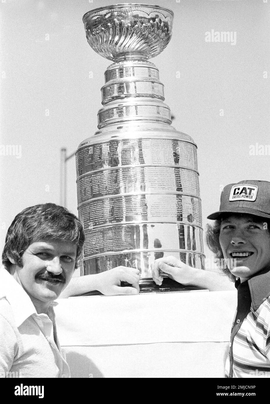 Philadelphia Flyers celebrate on the ice after winning the NHL Stanley cup  by beating the Boston Bruins in Philadelphia, May 19, 1974. Flyers center  Bobby Clarke, left, and goalie Bernie Parent, right, hold the trophy as  they celebrate. (AP Photo Stock