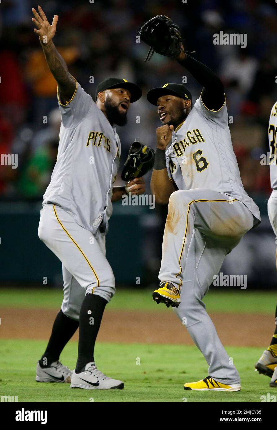Pittsburgh Pirates relief pitcher Felipe Vazquez, left, celebrates with  center fielder Starling Marte after the Pirates defeated the Los Angeles  Angels 10-2 in a baseball game in Anaheim, Calif., Monday, Aug. 12