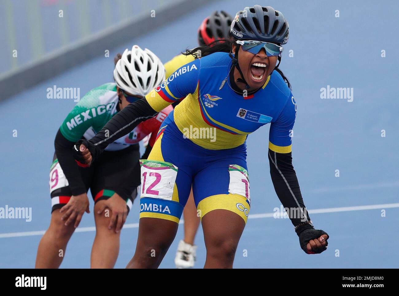 Geiny Pajaro of Colombia celebrates winning the gold medal in the speed ...