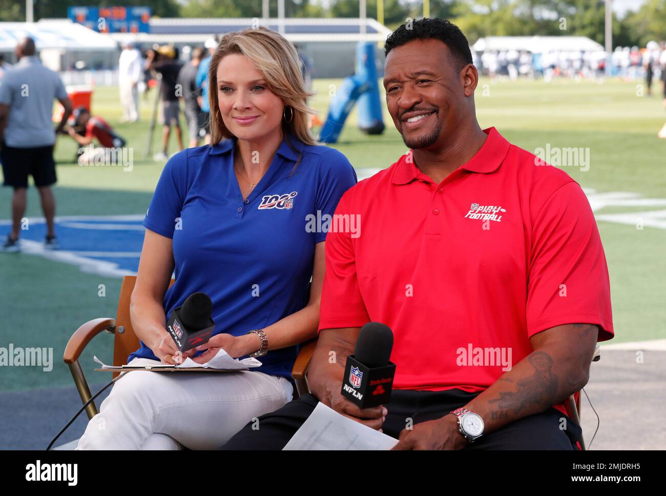 NFL Network anchor Stacey Dales, left, and analyst Willie McGinest, are  seen at the Detroit Lions NFL football training facility, Wednesday, Aug.  7, 2019, in Allen Park, Mich. (AP Photo/Carlos Osorio Stock