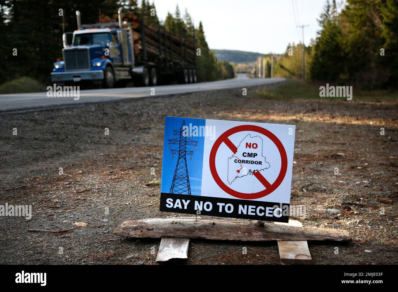 In this Tuesday, May 28, 2019 photo a sign protests Central Maine Power