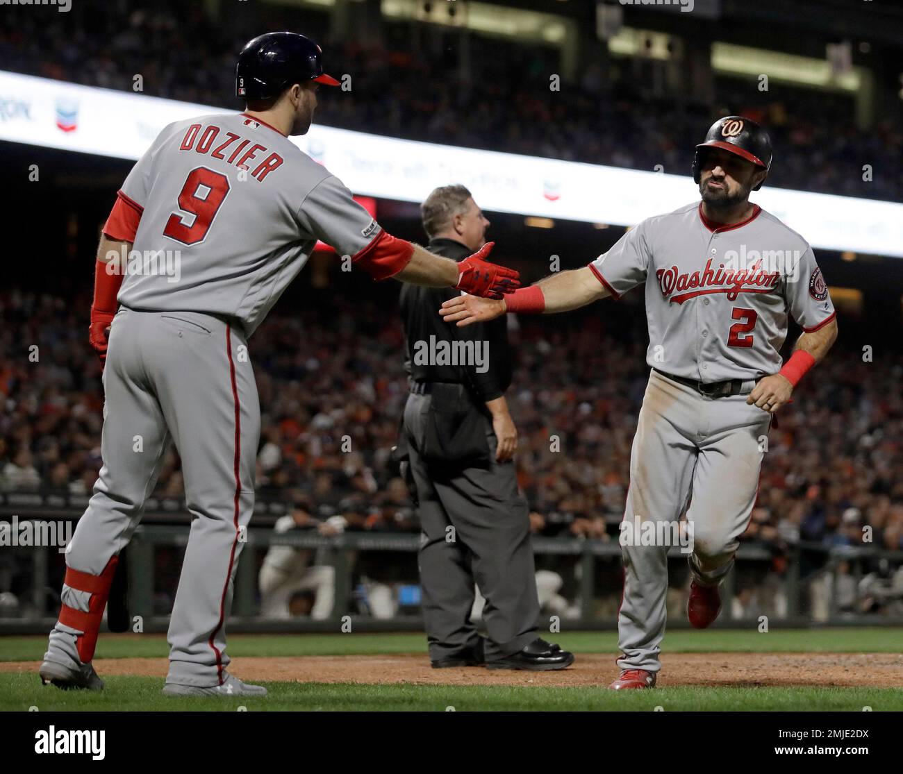 Washington Nationals' Brian Dozier and Adam Eaton celebrate after