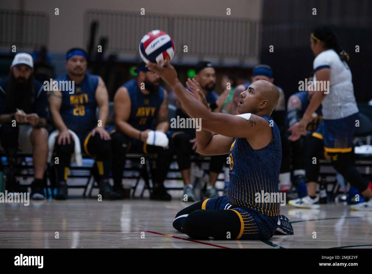 ORLANDO, Fla. (Aug. 27, 2022) U.S. Navy Hospital Corpsman Third Class Donald Calero, Team Navy, serves the ball during the sitting volleyball game against Team Air Force at the 2022 DoD Warrior Games. The Warrior Games are composed of over 200 wounded, ill and injured service members and veteran athletes, competing in 12 adaptive sporting events Aug. 19-28, 2022 at the ESPN Wide World of Sports Complex in Orlando, Florida. Stock Photo