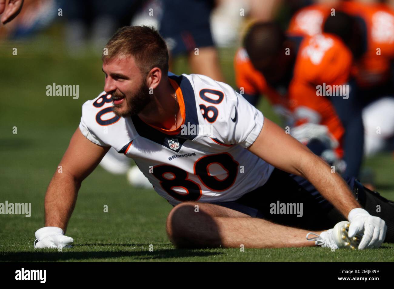 Denver Broncos tight ends coach Jake Moreland chats with tight end Eric  Saubert as he takes part in drills during the NFL football team's training  camp Thursday, Aug. 4, 2022, at the