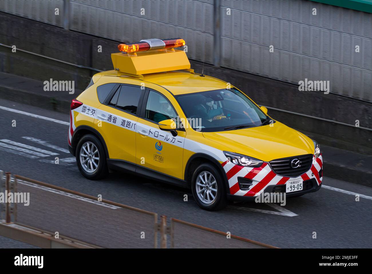 A patrol car operated by the Japanese Transport Ministry to inspect roads and ensure safety on a road in Kanagawa, Japan. Saturday Japan Stock Photo