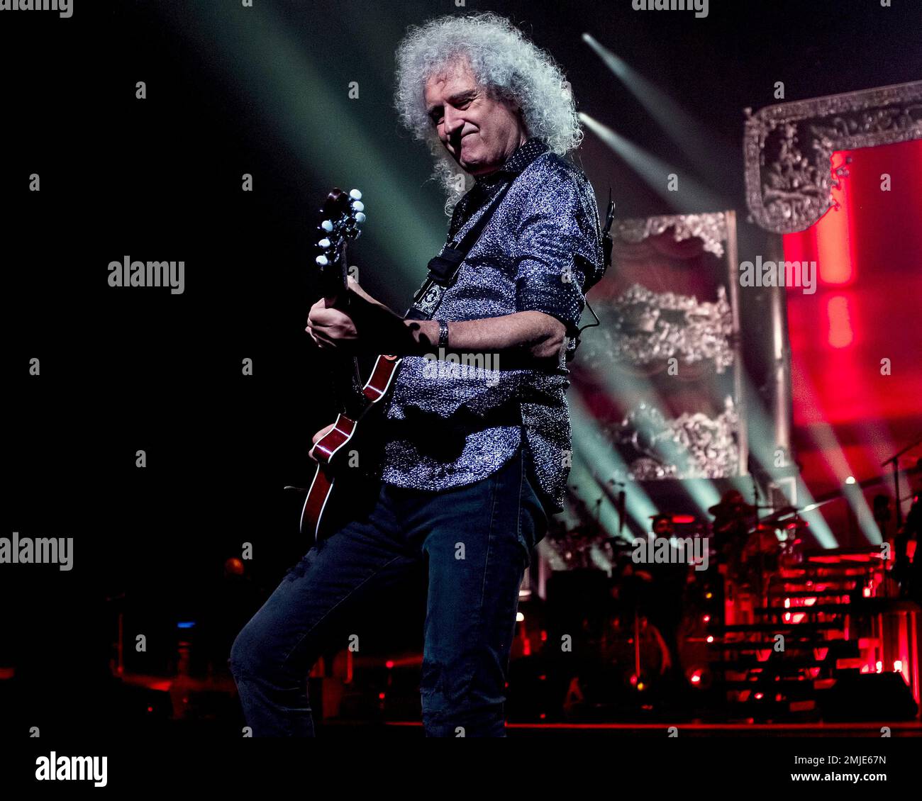 Queen lead guitarist Brian May performs with the band and Adam Lambert