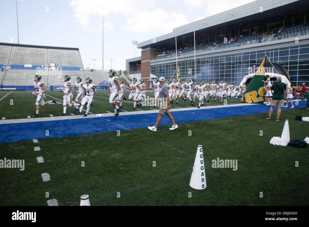 The Cedar Creek football team takes the field to face Evangel during