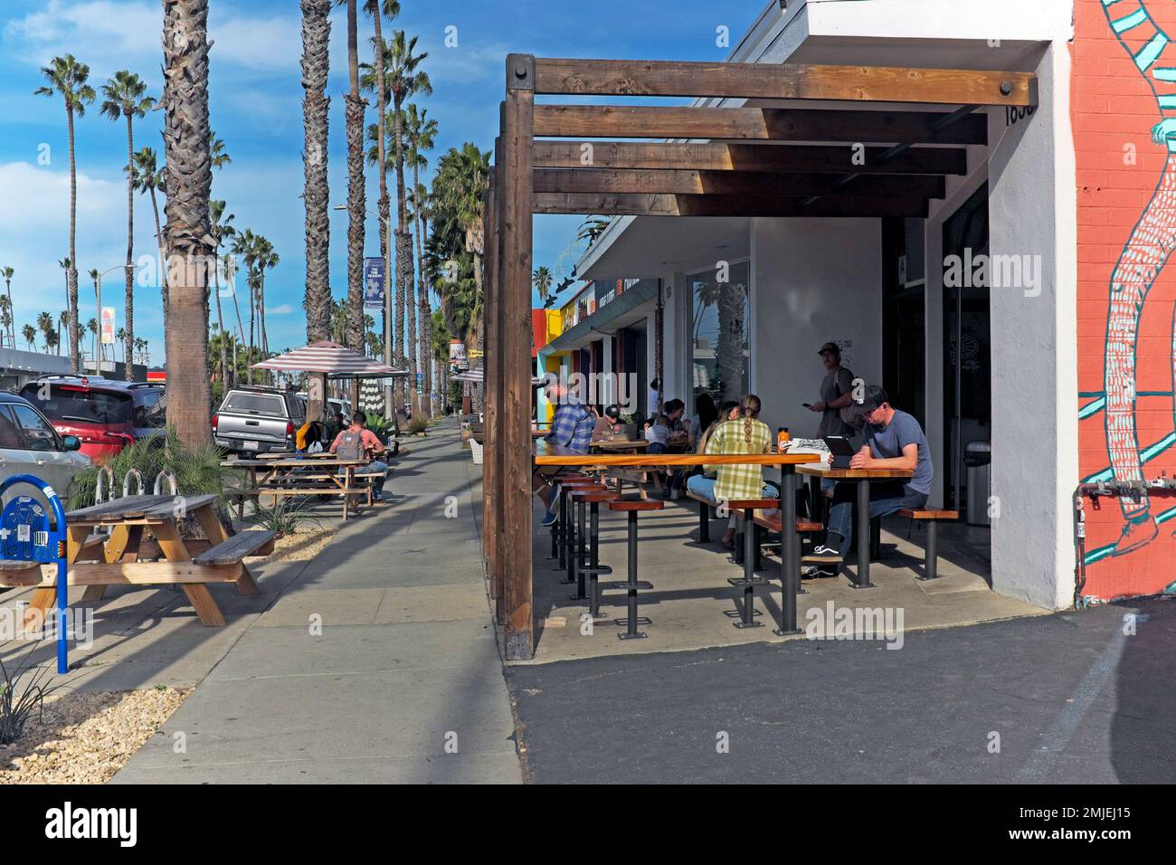 Revolution Roasters with its sidewalk cafe seating on Coast Highway in Oceanside, California, is part of the growing coffee culture. Stock Photo