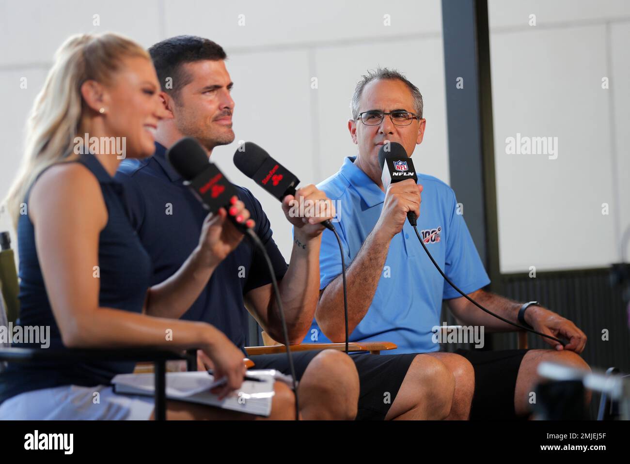 NFL Network show host Amber Theoharis, analyst David Carr and reporter  Michael Silver on the set during the New Orleans Saints training camp at  their NFL football training facility in Metairie, La.,