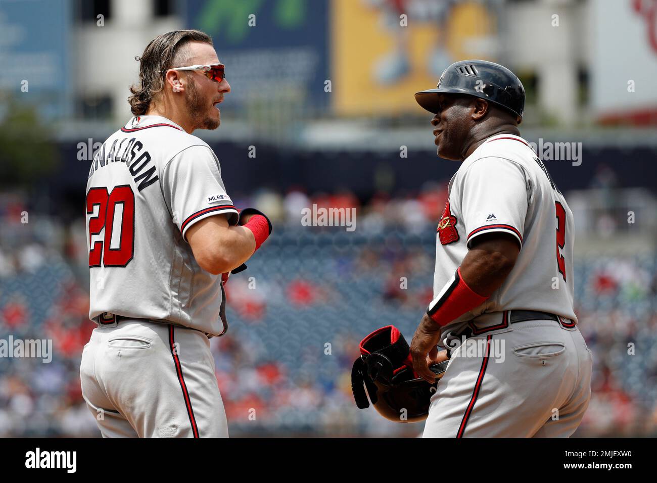 Atlanta Braves' Josh Donaldson, left, talks with first base coach Eric  Young after grounding out to end an inning of a baseball game against the  Washington Nationals, Wednesday, July 31, 2019, in