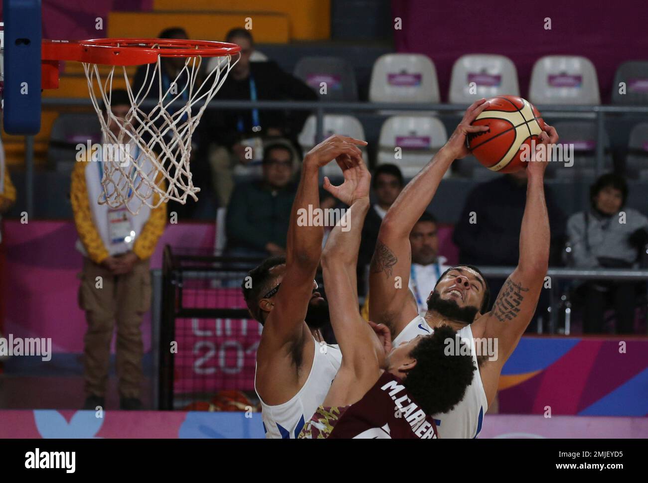 Puerto Rico's Emmanuel Andujar takes a rebound over Venezuela's Michael  Carrera during their basketball first round game at the Pan American Games  in Lima, Peru, Wednesday, July 31, 2019. (AP Photo/Fernando Llano