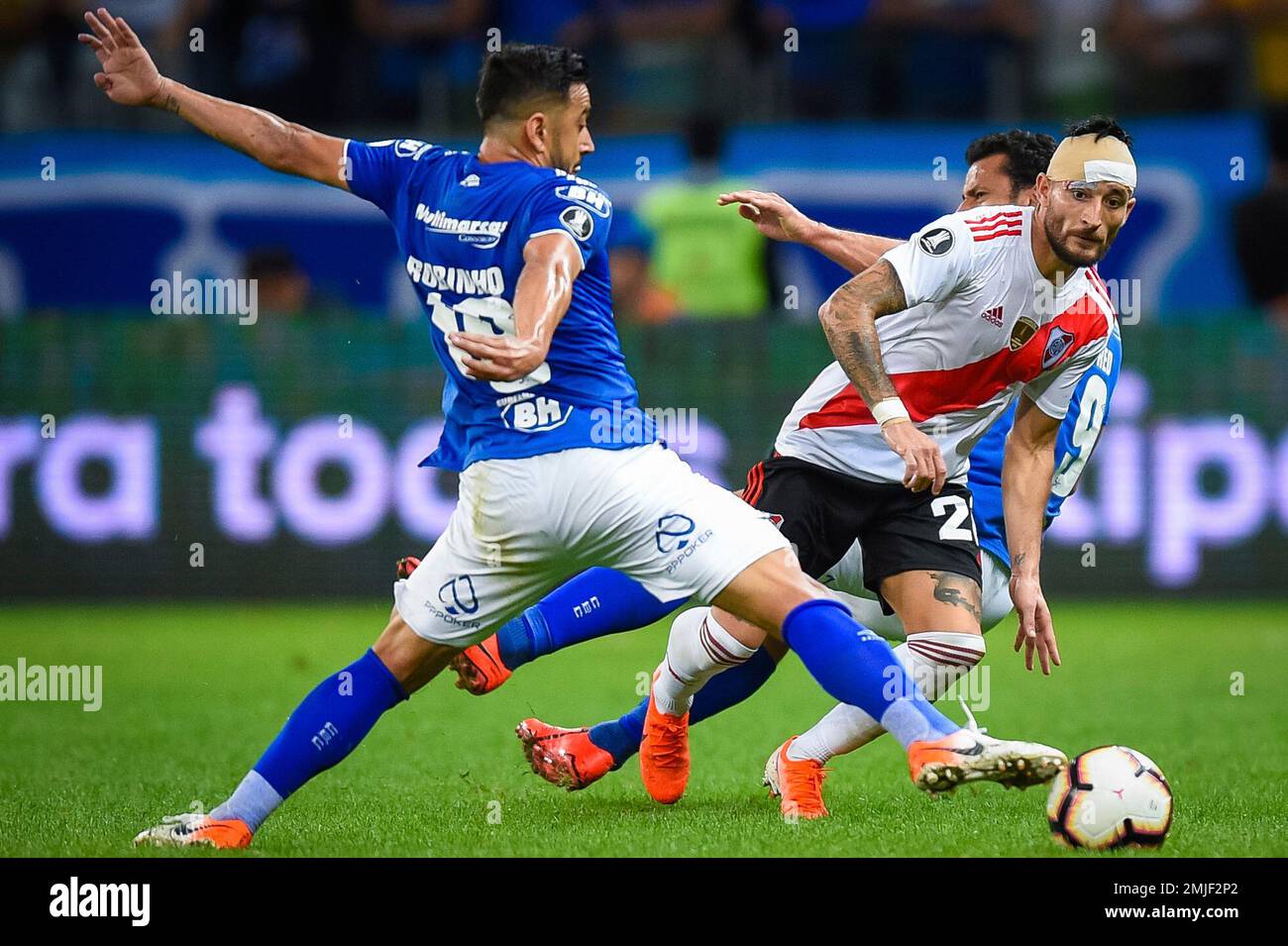 Rafinha of Brazil's Flamengo heads the ball challenged by Milton Casco of  Argentina's River Plate during the Copa Libertadores final soccer match at  the Monumental stadium in Lima, Peru, Saturday, Nov. 23