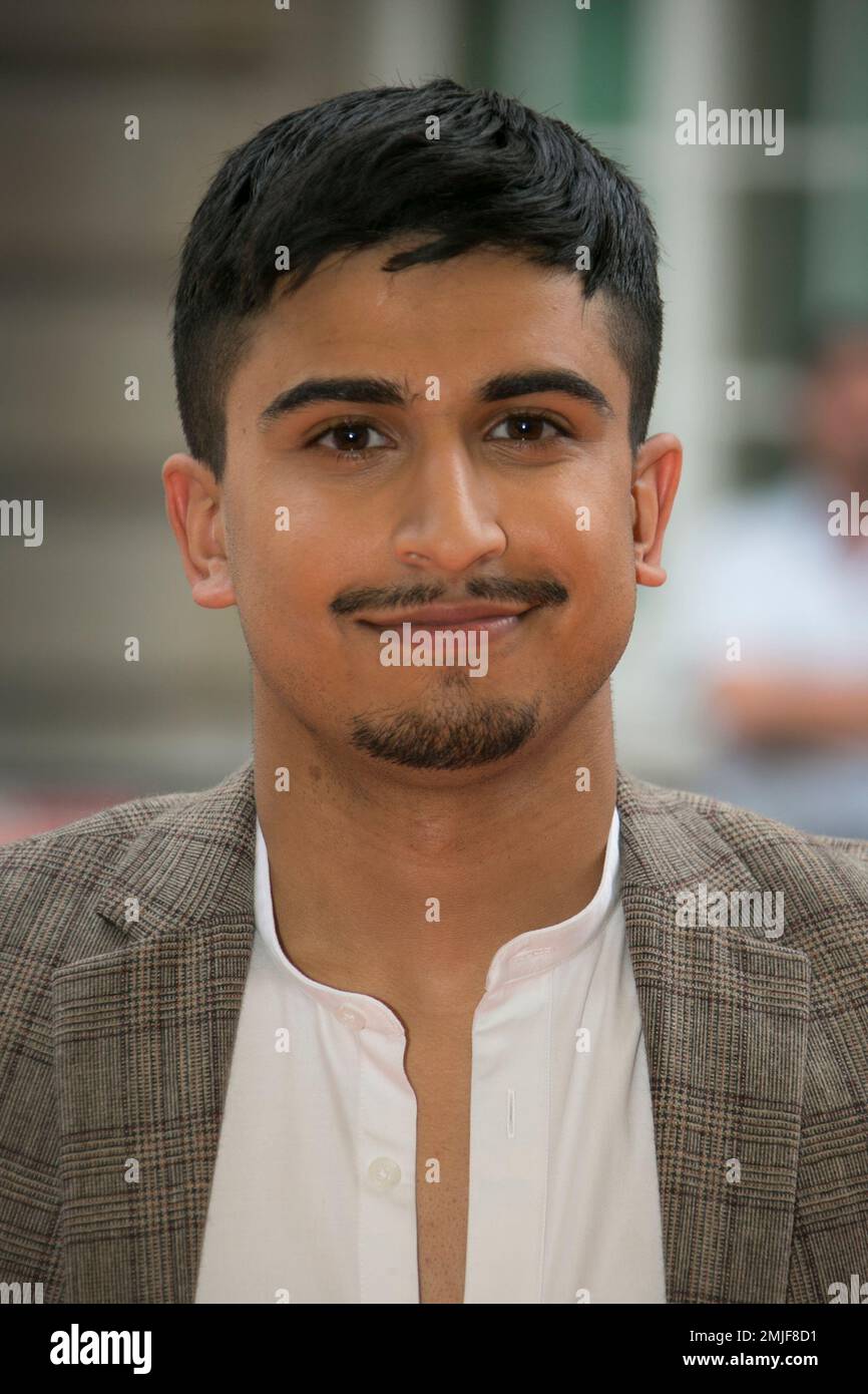 Aaron Phagura poses for photographers upon arrival at the screening for ...