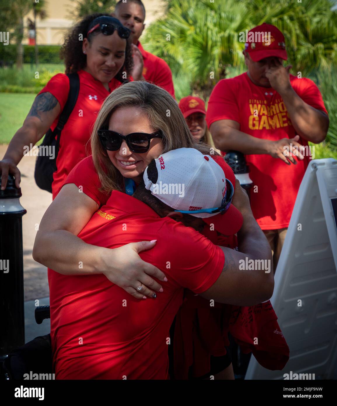 U.S. Marine Corps First Sgt. Cydney Rose, hugs Capt. Andrew Hairston