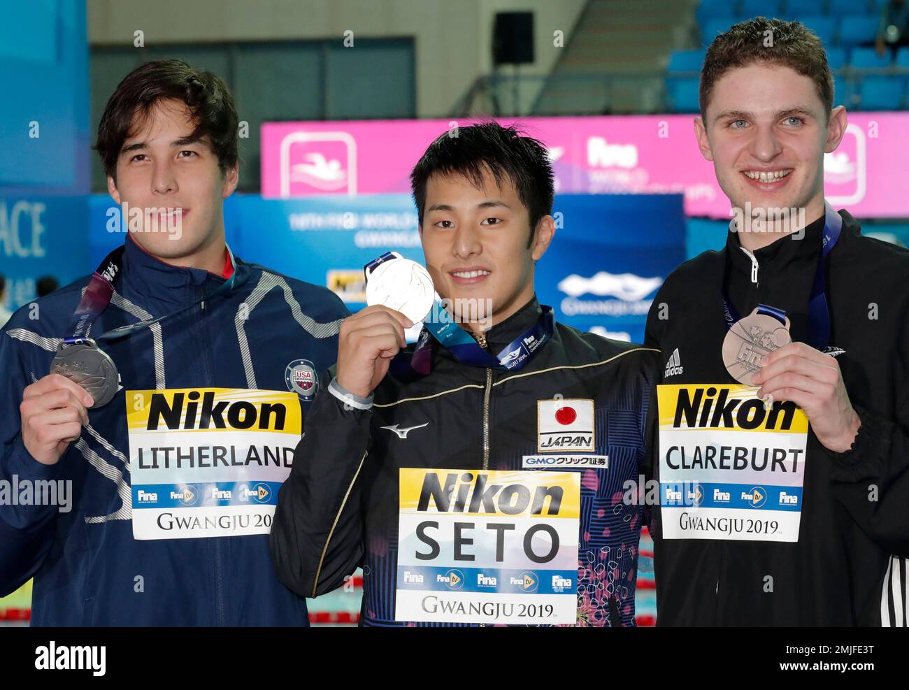 Gold medalist Japan's Daiya Seto, centre, stands with silver medalist