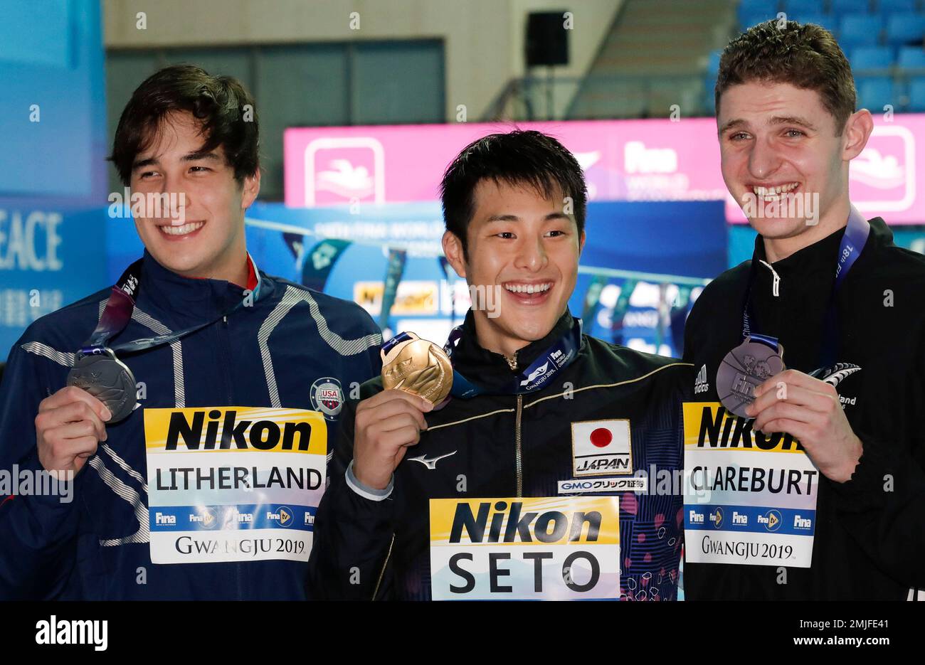 Gold medalist Japan's Daiya Seto, centre, stands with silver medalist