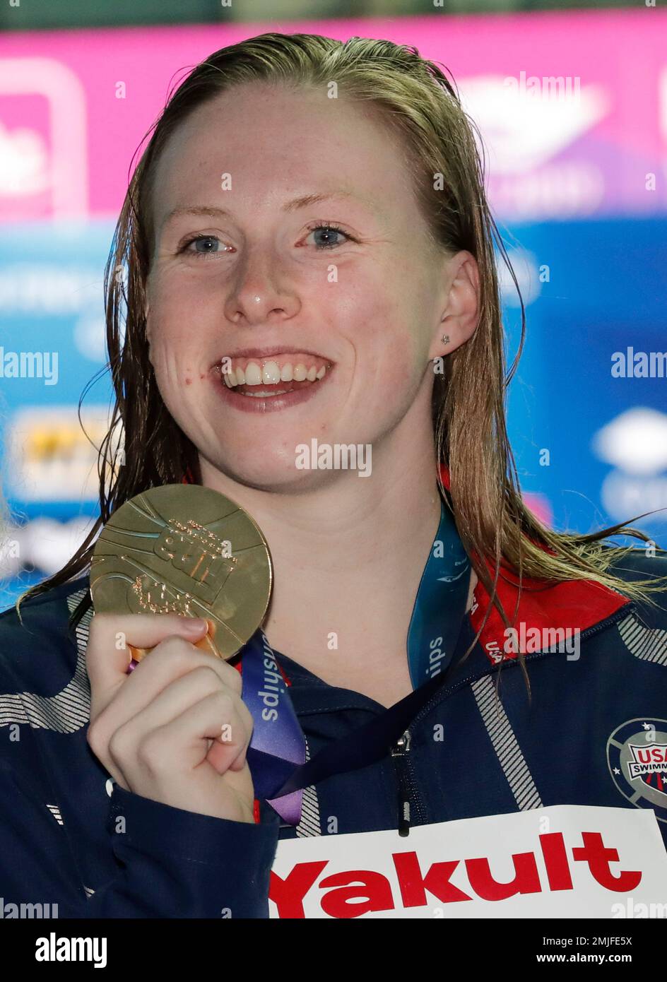 Gold medalist United States' Lilly King poses with her medal following