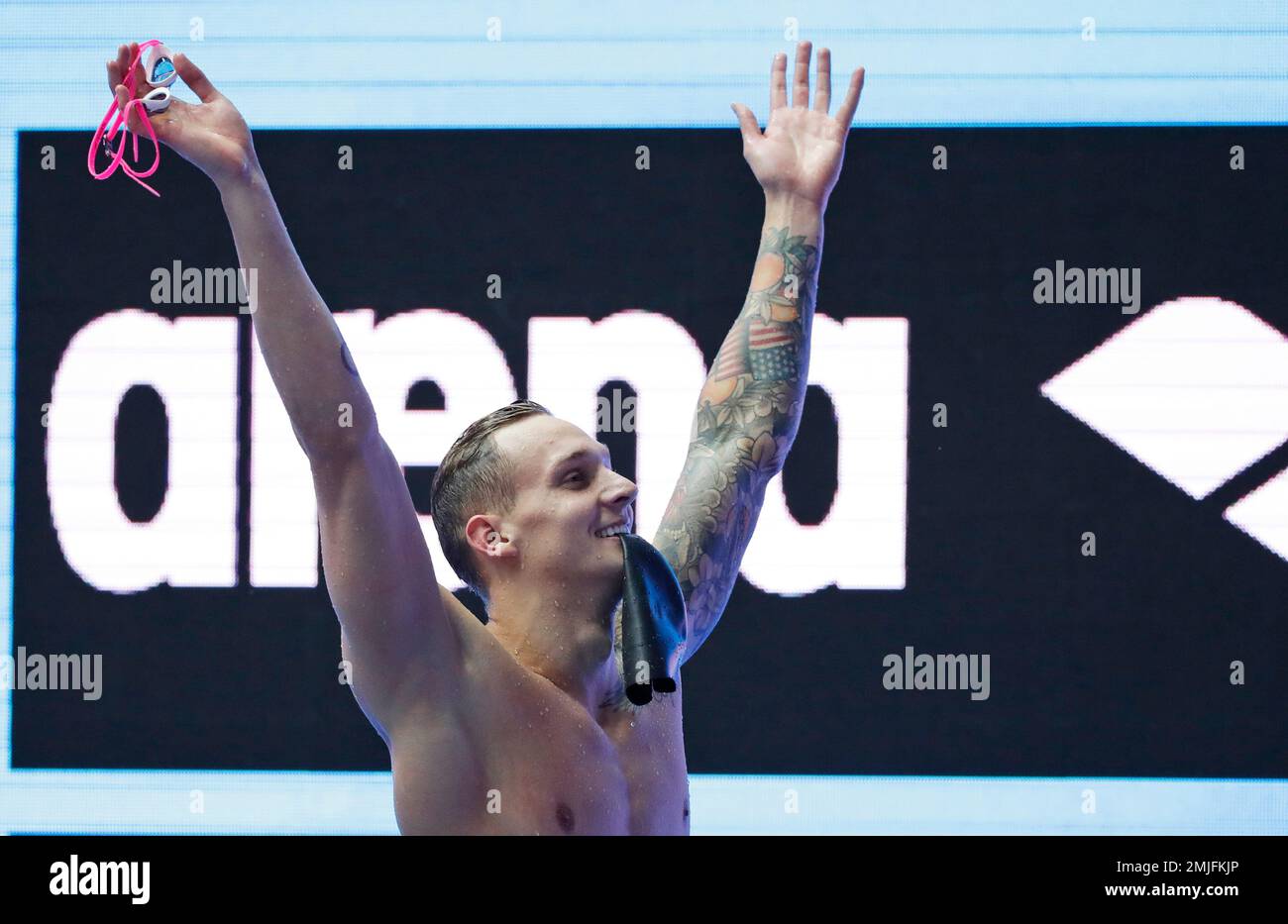 United States' Caeleb Dressel celebrates after winning the men's 100m ...
