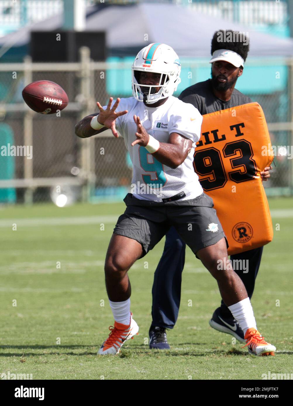 FILE - In this Sept. 8, 2019, file photo, Miami Dolphins running back Mark  Walton (22) warms up before an NFL football game against the Baltimore  Ravens, in Miami Gardens, Fla. The