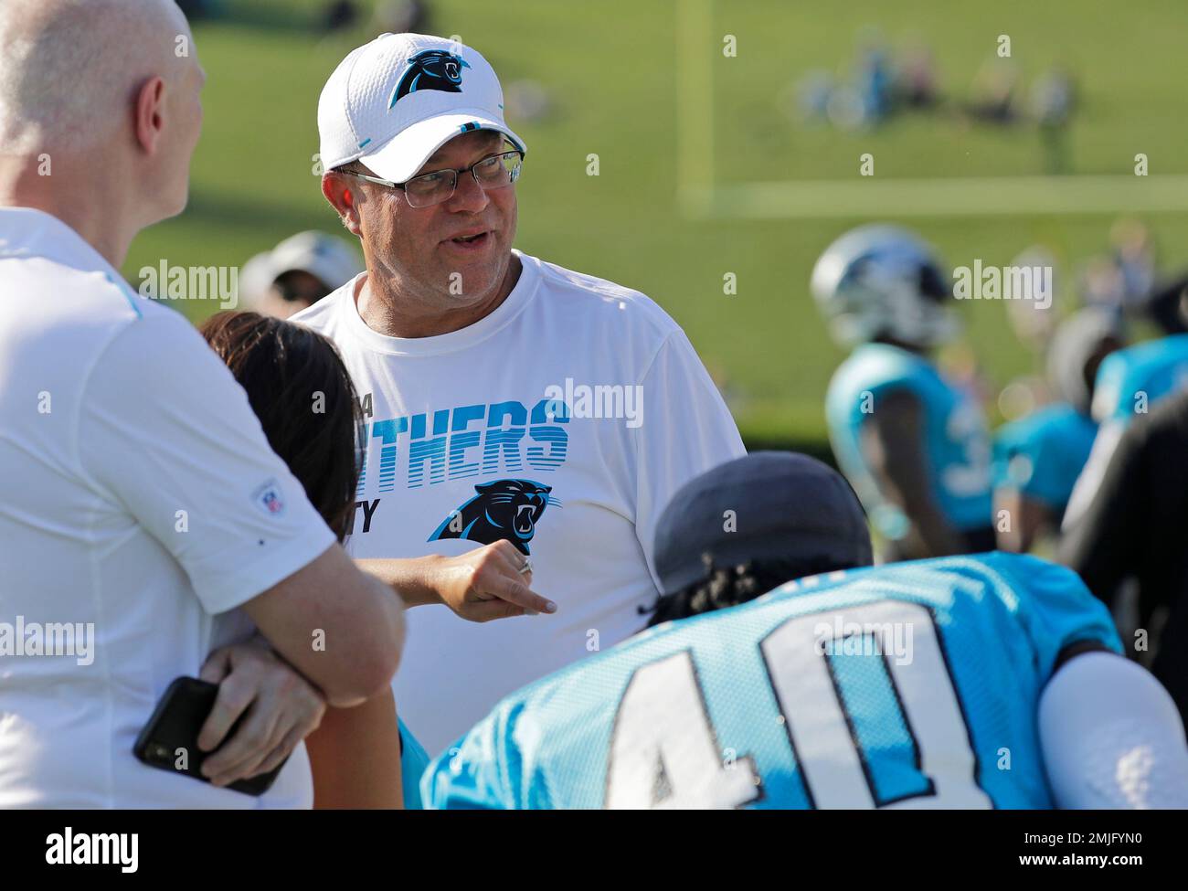 Carolina Panthers players push owner David Tepper for grass field