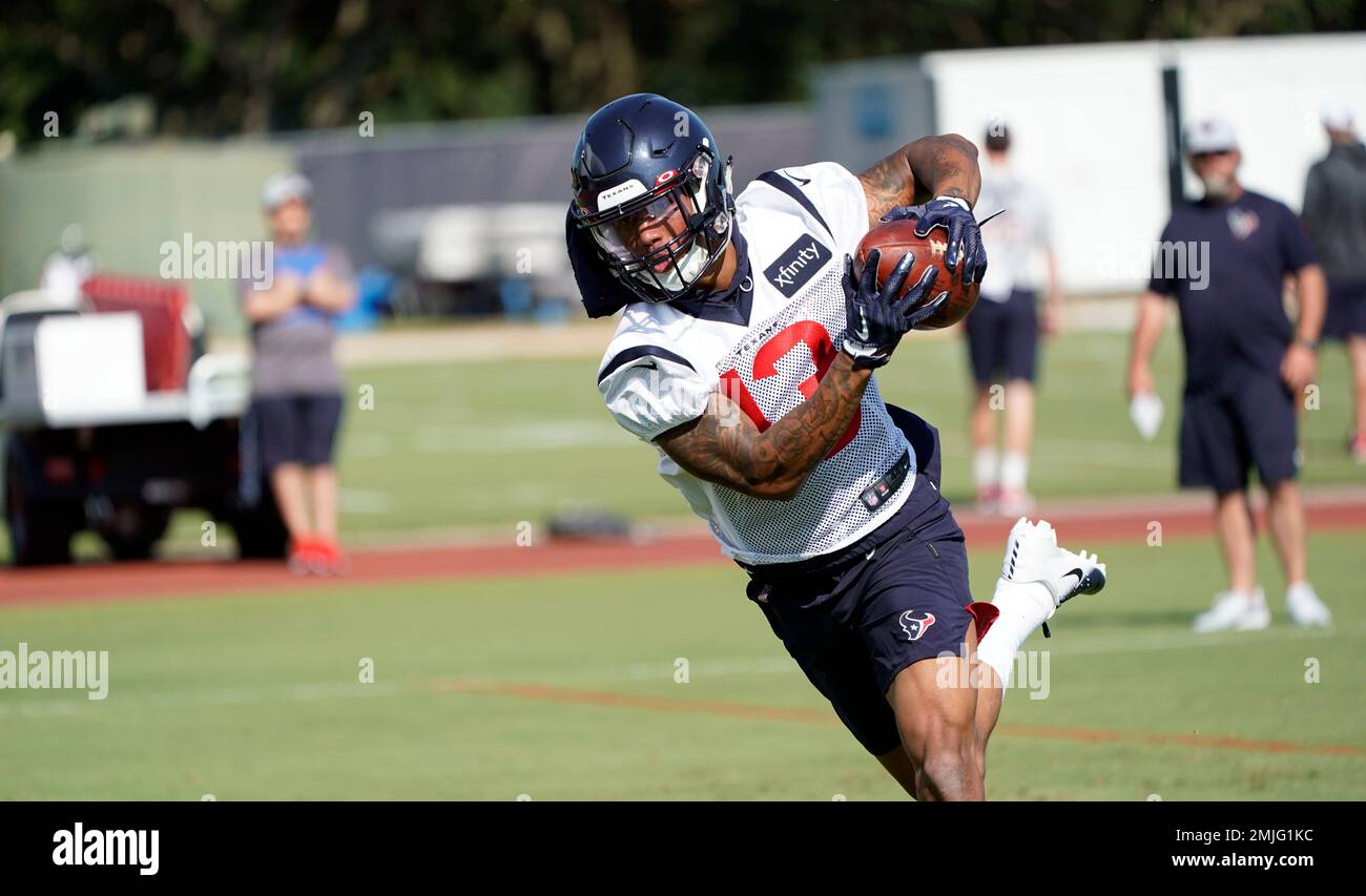 Houston Texans wide receiver Tyron Johnson (13) catches a pass during an NFL football training camp practice Thursday, July 25, 2019, in Houston