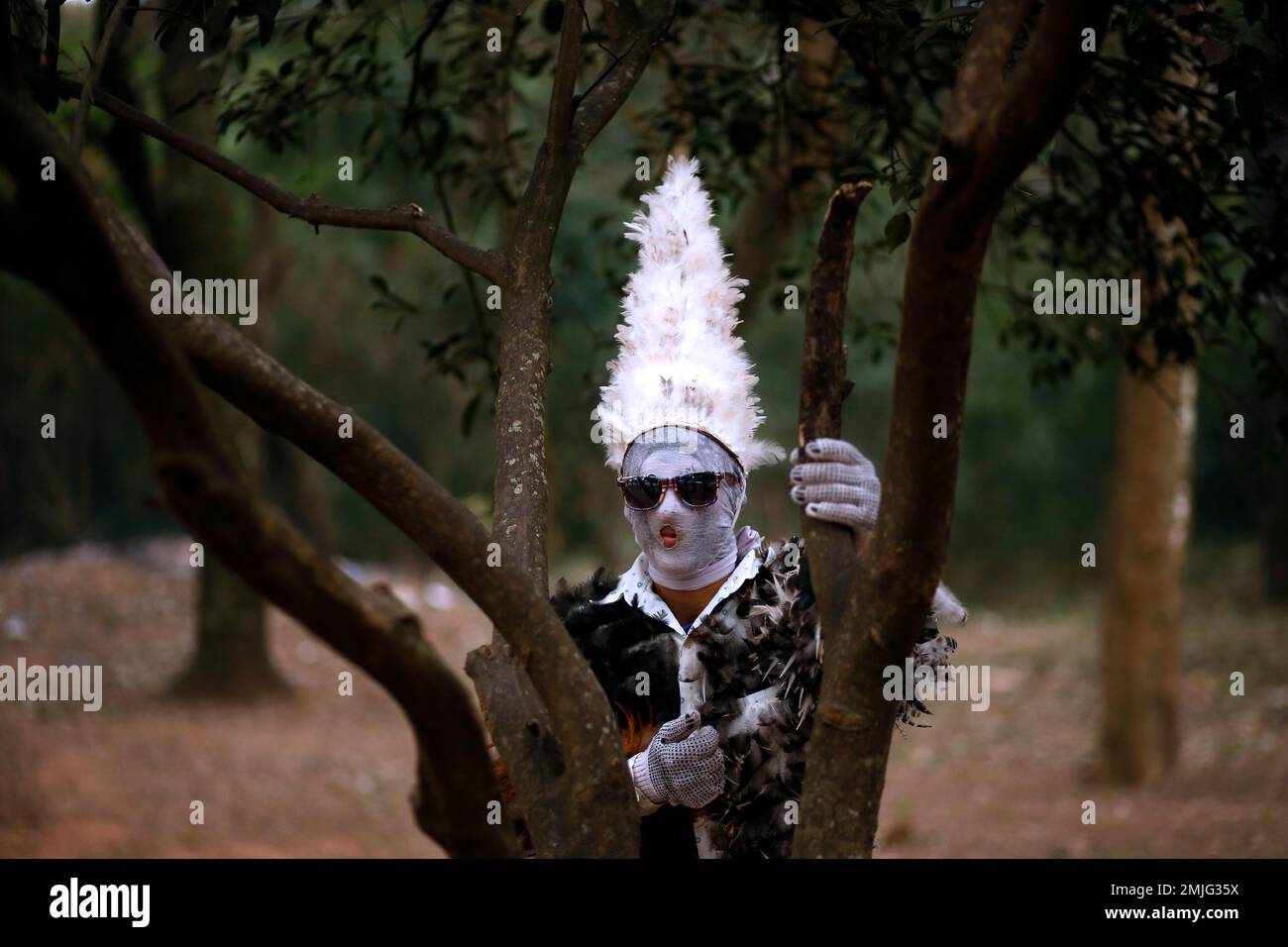 Agustin Armoa poses for a portrait wearing his feathered costume during a  Mass in honor of St. Francis Solano in Emboscada, Paraguay, Wednesday, July  24, 2019. Armoa has been a devotee for
