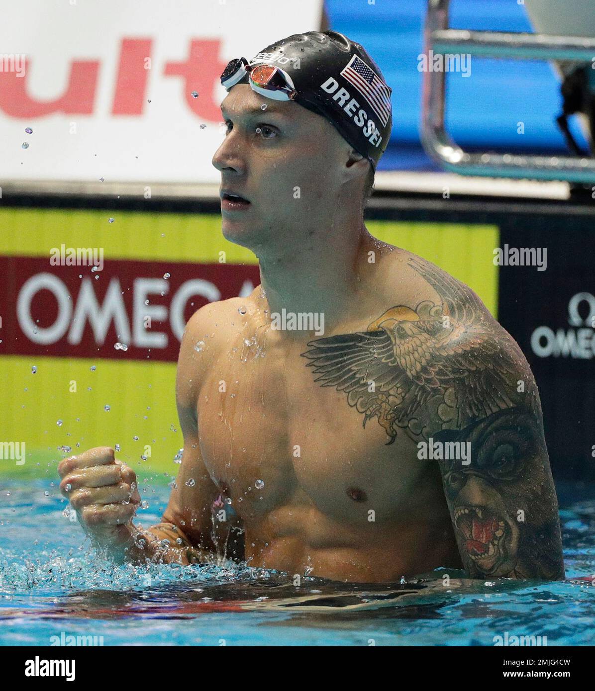 United States' Caeleb Dressel celebrates after winning the men's 100m ...