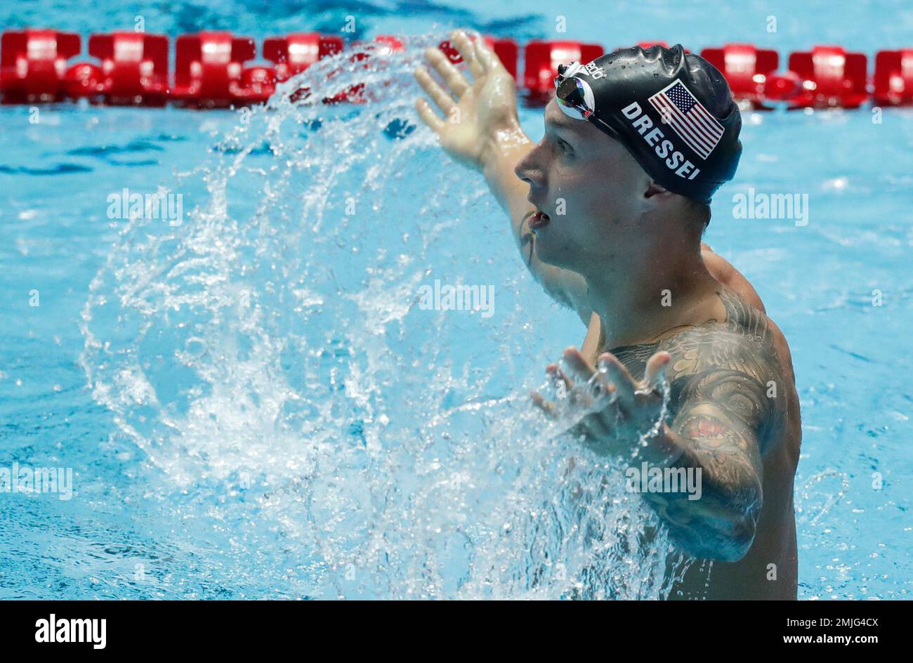 United States' Caeleb Dressel celebrates after winning the men's 100m ...