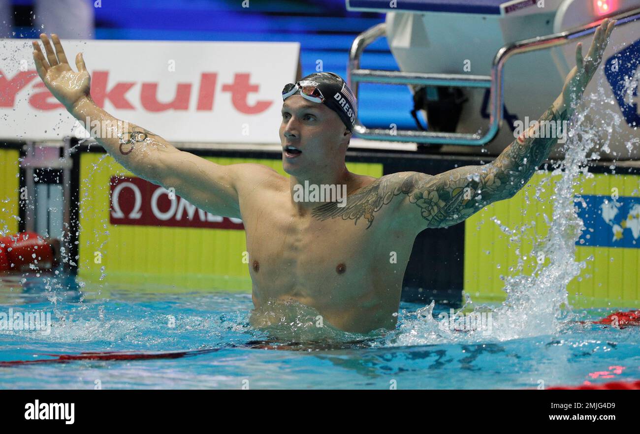 United States' Caeleb Dressel celebrates after winning the men's 100m ...