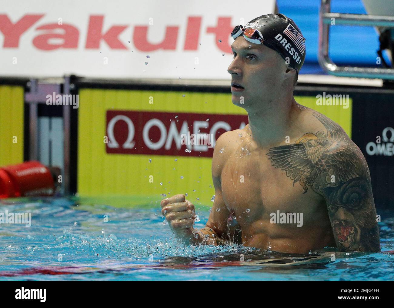 United States' Caeleb Dressel celebrates after winning the men's 100m ...