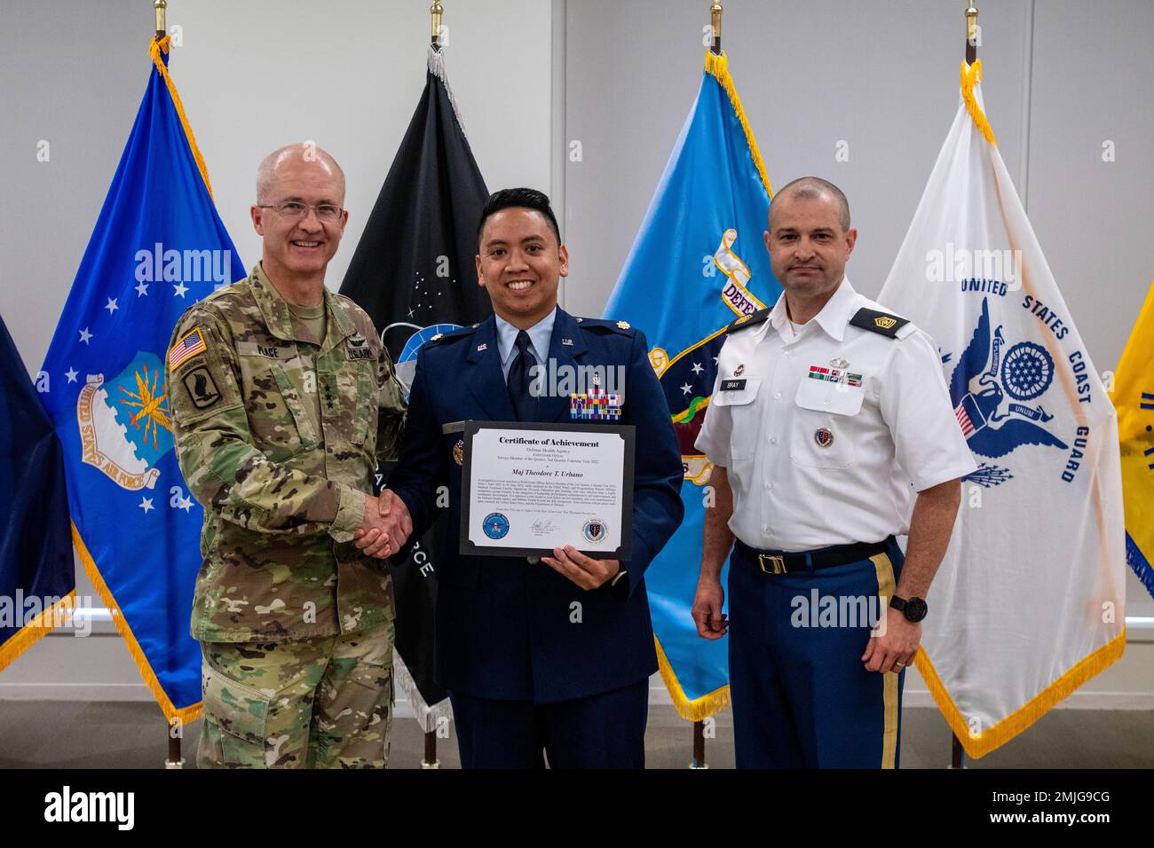 LTG Ronald J. Place, DHA Director, and SGM Isaac A. Bray, present the Field Grade Officer of the 2nd Quarter, Calendar Year 2022 Award to Major Theodore T. Urbano, United States Air Force Education and Training (J7). DHA holds quarterly recognition ceremonies to honor DHA employees across the enterprise for their dedication to the DHA mission: Unified. Ready. Reliable. Stock Photo