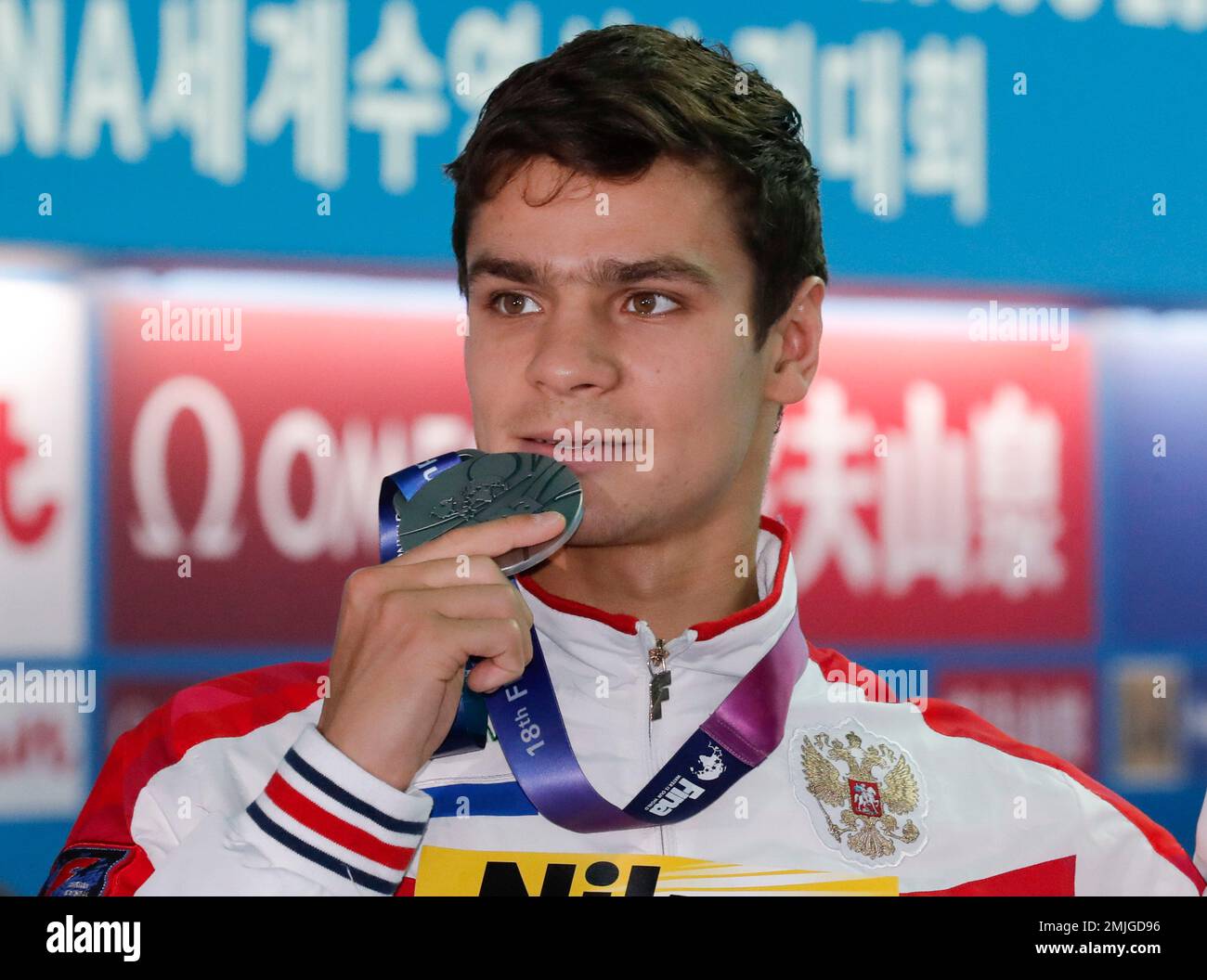 Silver medalist Russia's Evgeny Rylov poses with his medal following ...