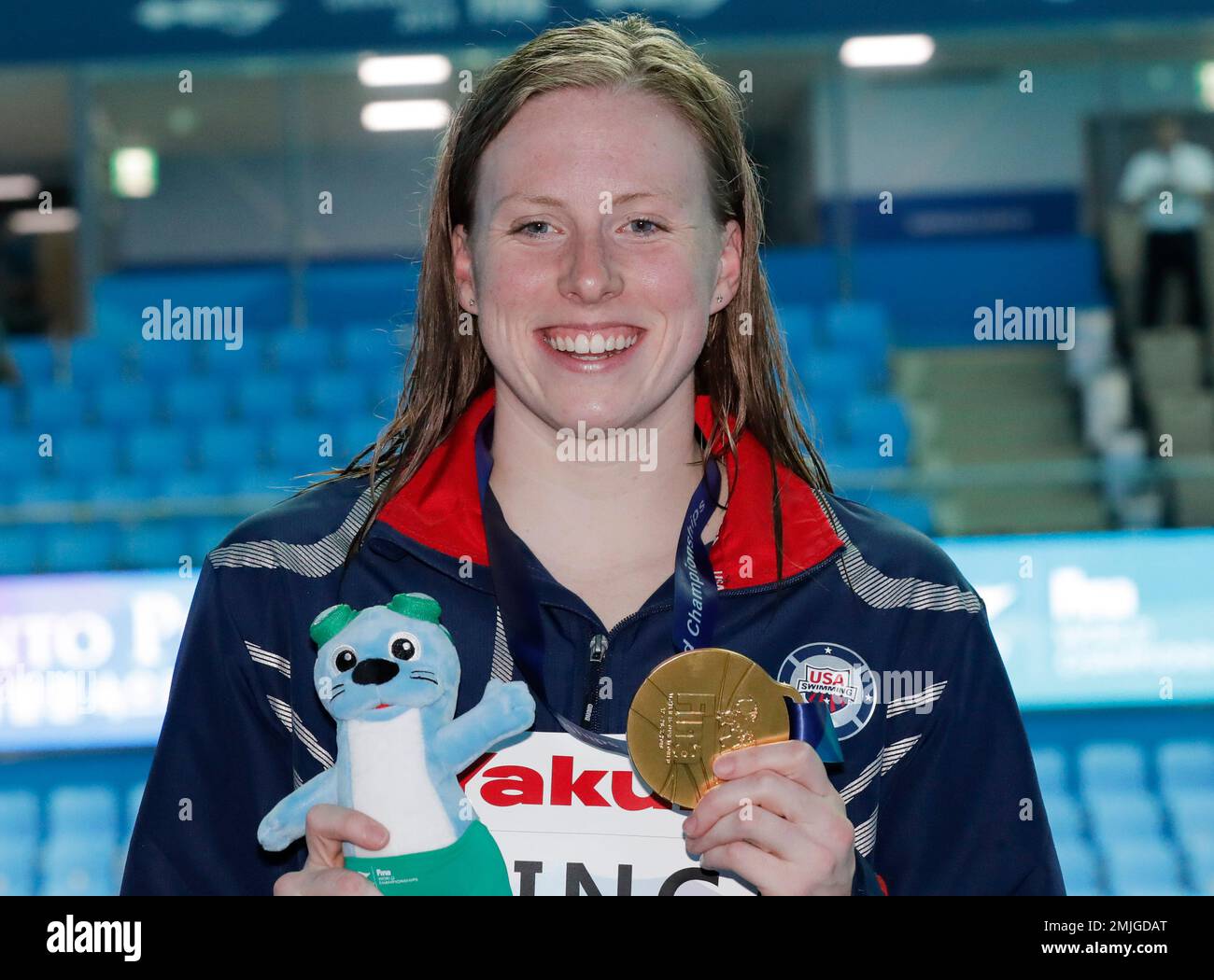 Gold medalist United States' Lilly King poses with her medal following