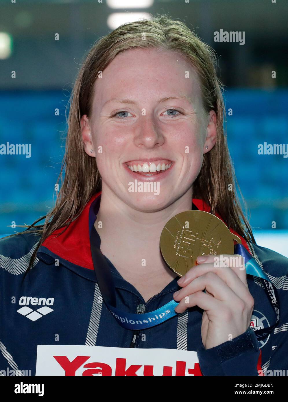 Gold medalist United States' Lilly King poses with her medal following