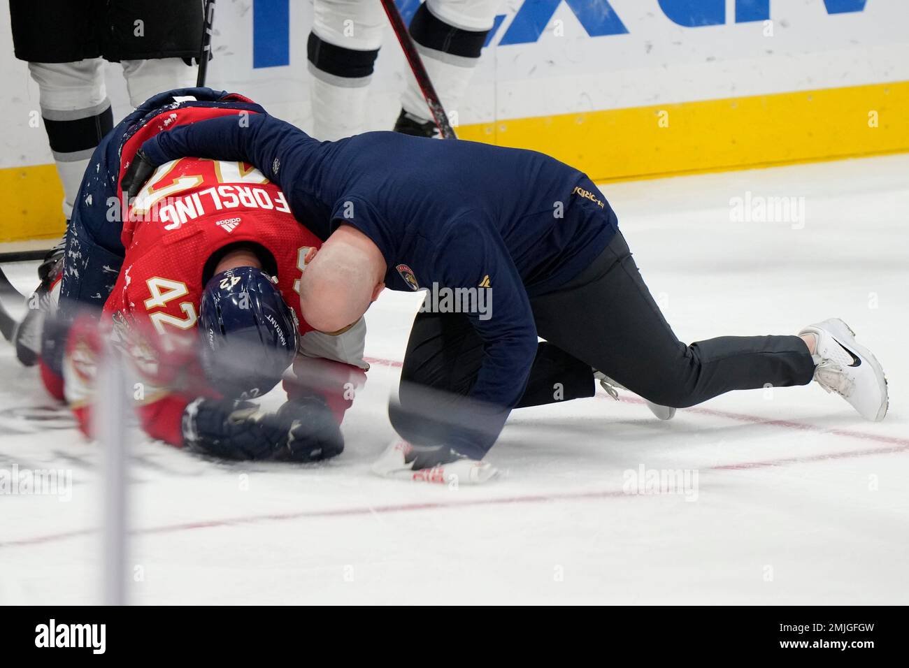 Florida Panthers defenseman Gustav Forsling (42) is helped off the ice  during the second period of an NHL hockey game against the Los Angeles  Kings, Friday, Jan. 27, 2023, in Sunrise, Fla. (