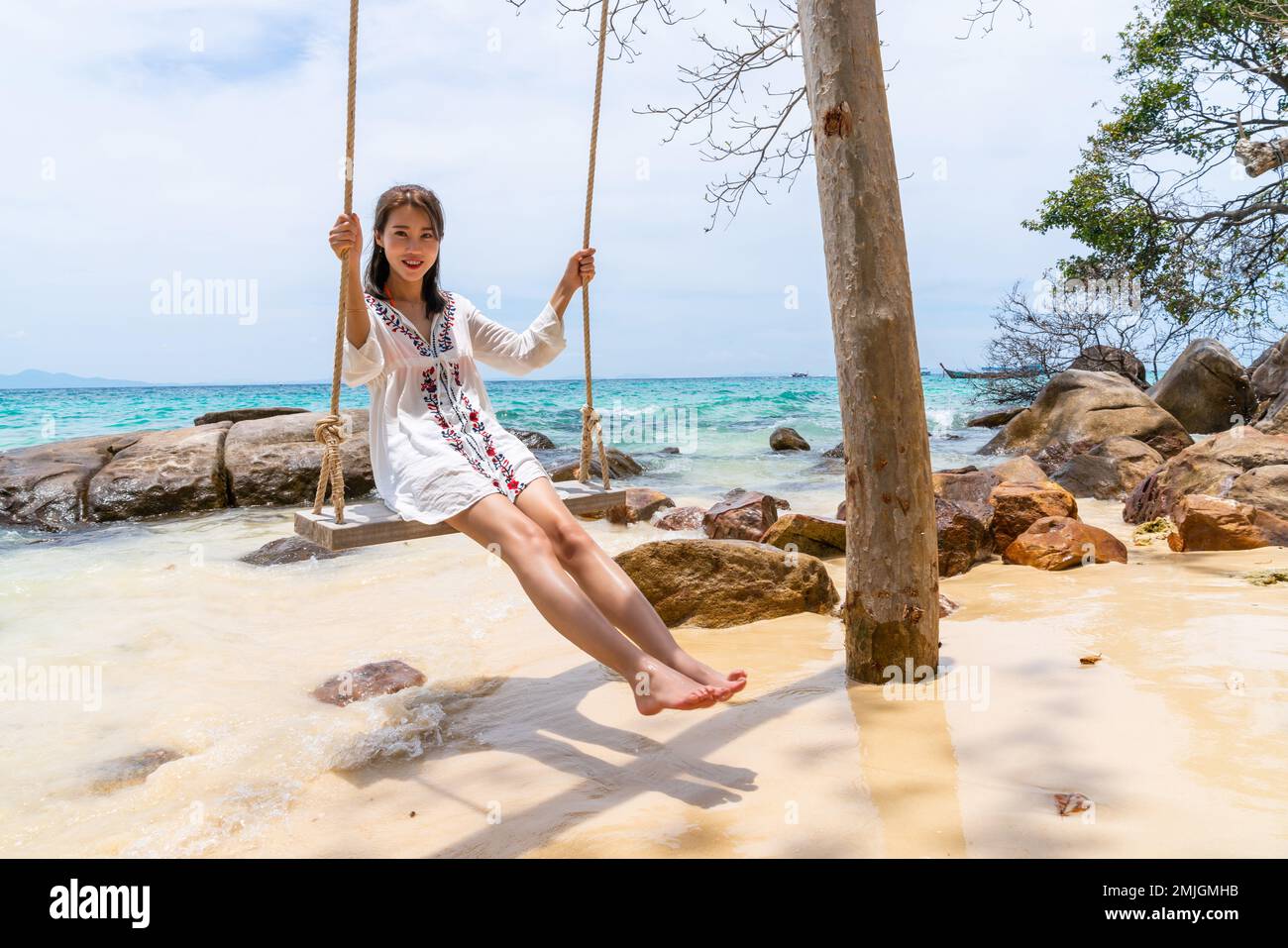 Happy young woman on the beach Stock Photo - Alamy