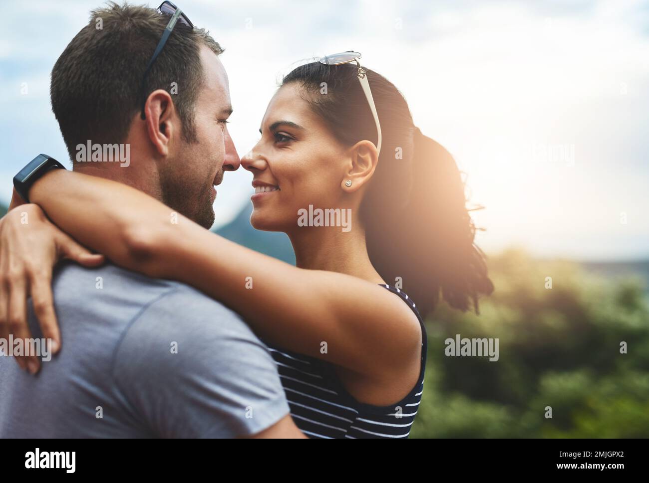 Love at first sight and every one afterwards. a young couple in a loving embrace outdoors. Stock Photo