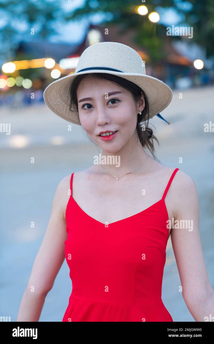 Happy young woman on the beach Stock Photo - Alamy