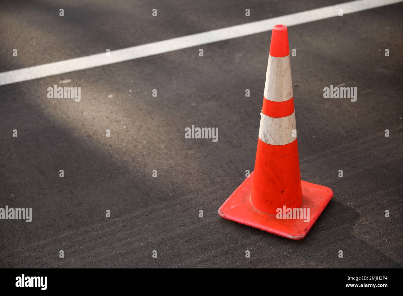 construction cones middle of street roadblock danger orange Stock Photo