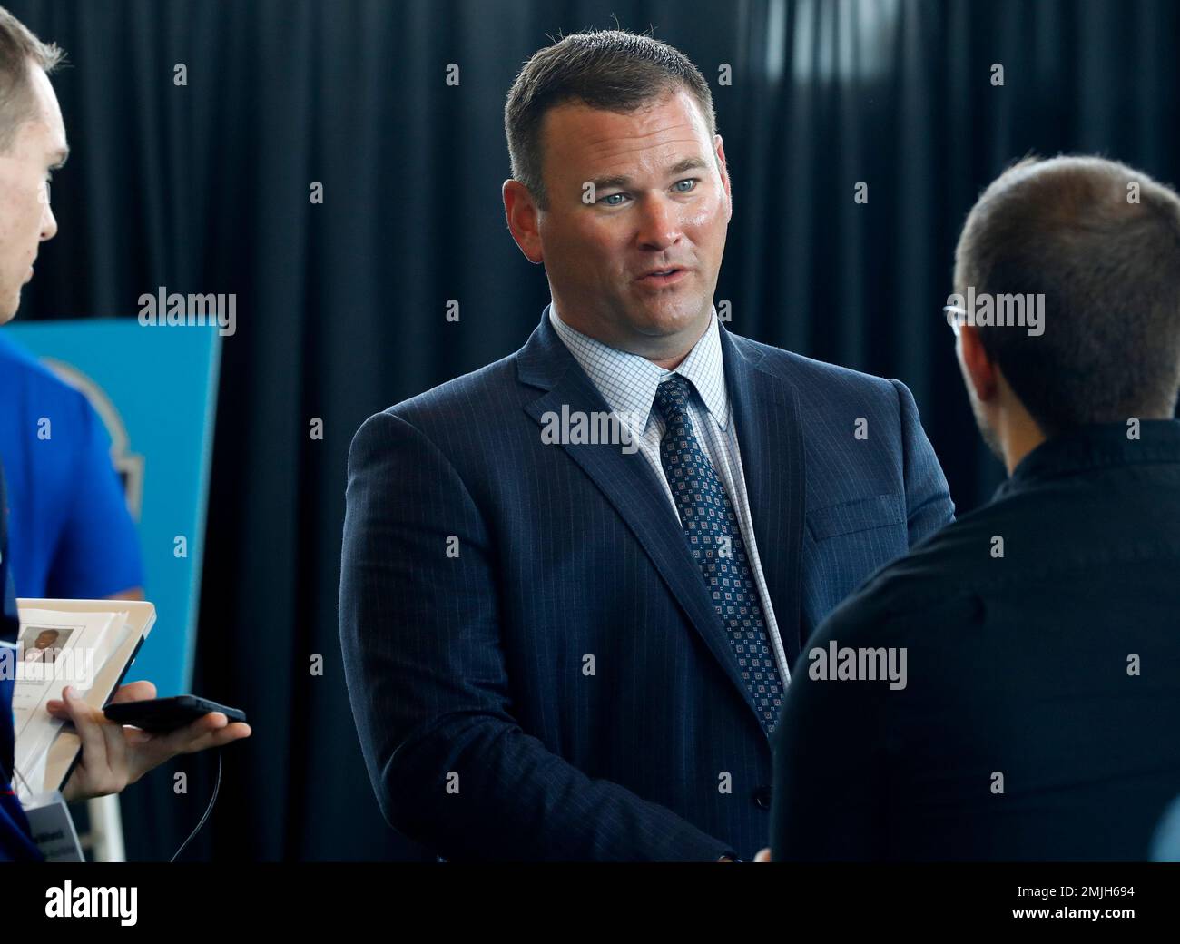 Rice coach Mike Bloomgren talks with reporters during the Conference ...