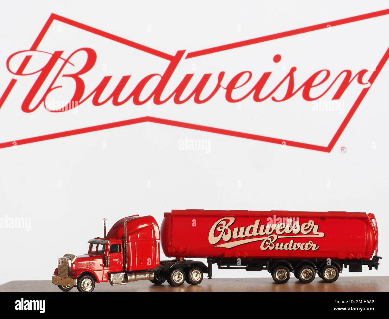 Germany. 28th Jan, 2023. In this photo illustration, a model of a beer truck with an inscription Budweiser in the background of the company logo on the monitor screen. Budweiser Pale Lager was introduced by Carl Conrad & Co. in 1876. It is now the best-selling beer in the US. The brand is owned by Anheuser-Busch Companies. Credit: SOPA Images Limited/Alamy Live News Stock Photo