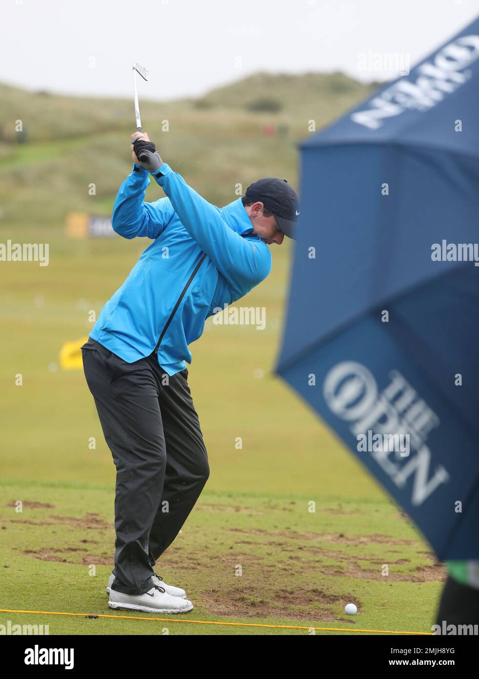 Northern Ireland's Rory McIlroy prepares to hit a shot on the practice  range ahead of the start of the British Open golf championships at Royal  Portrush in Northern Ireland, Wednesday, July 17,